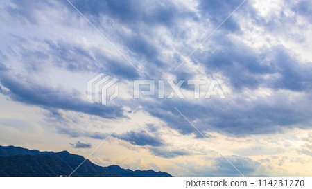 Beautiful clouds in the evening sky 114231270