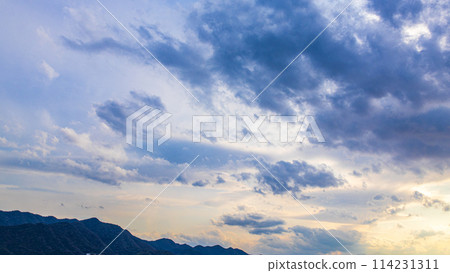 Beautiful clouds in the evening sky 114231311