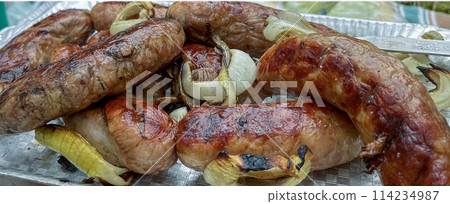 In the forest, barbecue sausages are fried outdoors 114234987