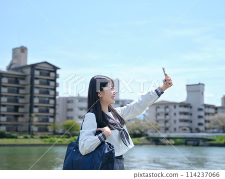 High school girl using smartphone High school girl using smartphone 114237066