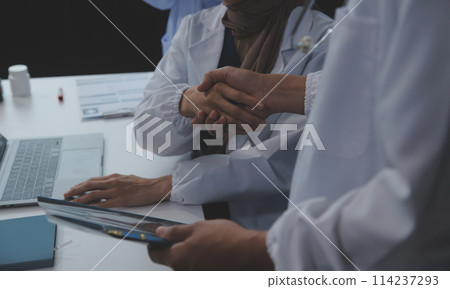 The medical team joins hands and works togetherGroup of scientists joining hands to create experimental works that meet their goals or the success of the trials that have been completed 114237293