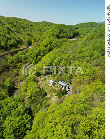 Aerial view of Yuhama Pass with fresh greenery on National Route 398 Aerial view of Yuhama Pass with fresh greenery on National Route 398 114240896