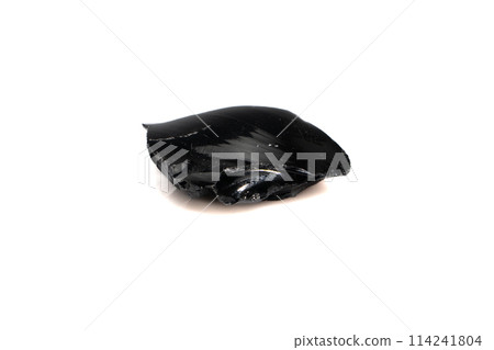 natural obsidian rough gem stone on the white background 114241804