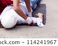 First aid after workplace accident 114241967