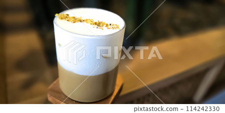 Fresh iced coffee in glass with frothy cream for your design, Food concept in style, copy space 114242330