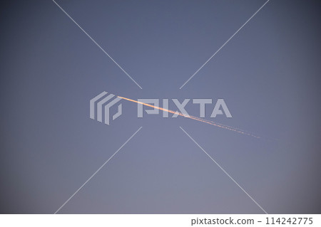 White passenger airplane flying in the sky amazing clouds in the background - Travel White passenger airplane flying in the sky amazing clouds in the background - Travel 114242775