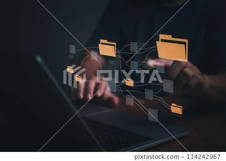 IT working on computer Business processes Document Management System DMS business processes and ensuring digital security. store, share, and organize documents and files. 114242967