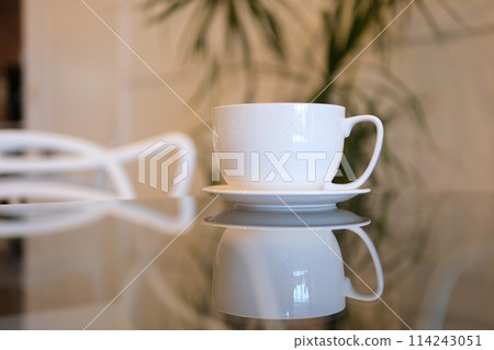 Cup of latte coffee in the shape of heart and coffee beans on old wooden background. High quality photo Cup of latte coffee in the shape of heart and coffee beans on old wooden background. High quality photo 114243051