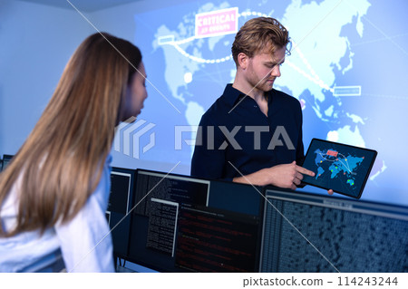 Cyber security team working in a Cyber Security Operations Center SOC to protect systems and technologies Cyber security team working in a Cyber Security Operations Center SOC to protect systems and technologies 114243244
