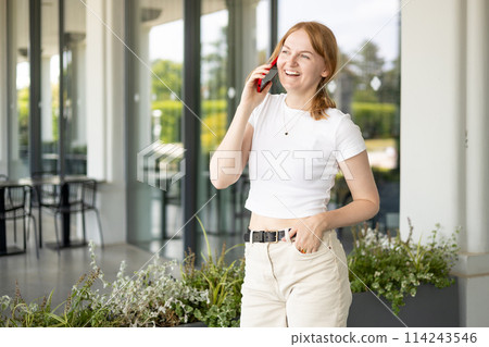 Happy blonde 30s woman talking phone and look happy outdoors Urban lifestyle concept. Summer time 114243546