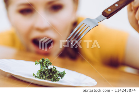 Shocked young woman being on diet 114243874