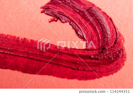 red brush stroke on orange paper, abstract background, hand painted 114244351