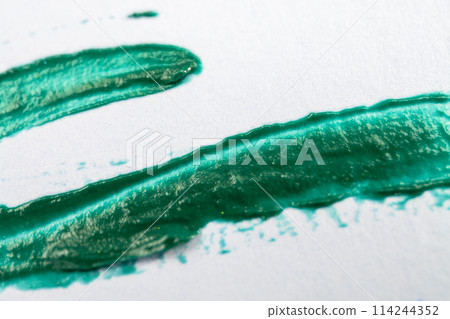 green brush stroke on white paper, abstract background, hand painted 114244352