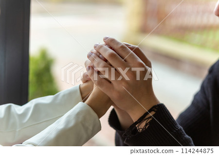 Couple enjoying a coffee holding hands. Couple enjoying a coffee holding hands. 114244875