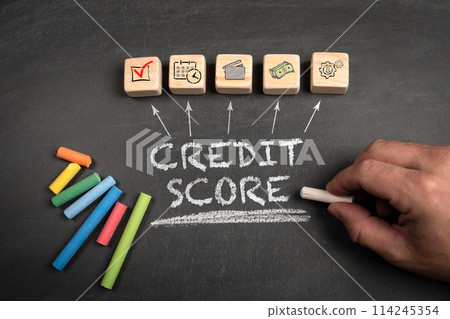Credit Score. Wooden blocks on a dark chalkboard background Credit Score. Wooden blocks on a dark chalkboard background 114245354