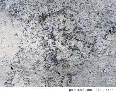 Dusty peeling paint wall background, texture of a concrete old wall with stains and cracks Dusty peeling paint wall background, texture of a concrete old wall with stains and cracks 114245378