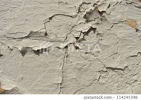 Dusty peeling paint wall background, texture of a concrete old wall with stains and cracks 114245396