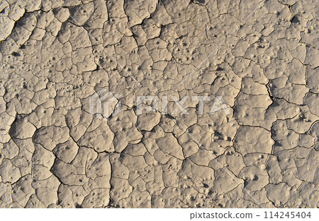 Dusty peeling paint wall background, texture of a concrete old wall with stains and cracks 114245404