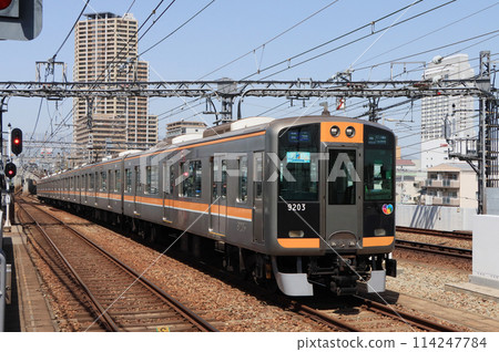 Hanshin 9000 series train arriving at Daimono Station on the Hanshin Namba Line Hanshin 9000 series train arriving at Daimono Station on the Hanshin Namba Line 114247784