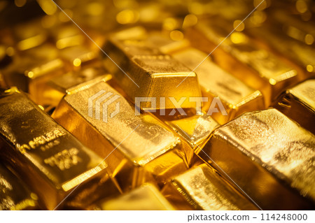 Banking finance concept background - pile of gold bars bullions ingots close up 114248000