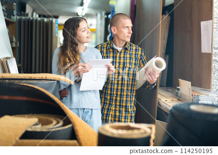 Woman and man discussing shopping list in building store 114250195