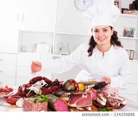 Cook woman with smoked products Cook woman with smoked products 114250886