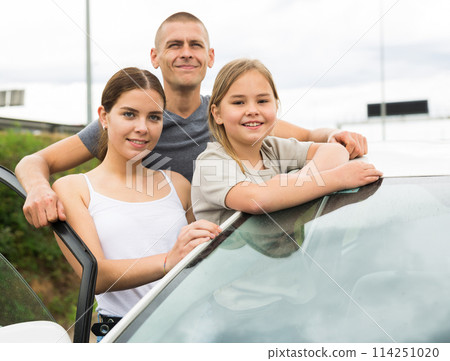Happy family posing near new car Happy family posing near new car 114251020