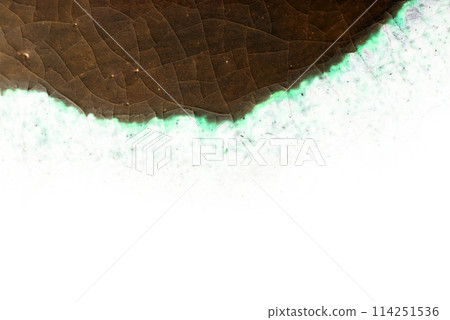 Retro tea ceremony tea bowl with dark brown and light green border crackle pattern on a white background (high contrast retouched texture) Retro tea ceremony tea bowl with dark brown and light green border crackle pattern on a white background (high contrast retouched texture) 114251536