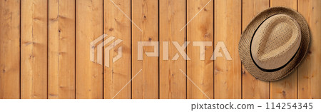 Straw Hat on Wooden Background. File with Clipping Path. Straw Hat on Wooden Background. File with Clipping Path. 114254345