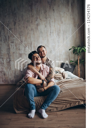 Gay couple at home, intimate moments of private life - Homosexual partners Gay couple at home, intimate moments of private life - Homosexual partners 114254376