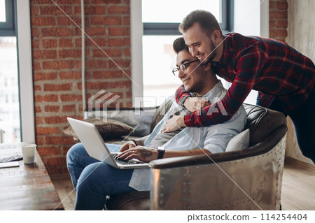 Homosexual partners working at office desk, relationships and business concept Homosexual partners working at office desk, relationships and business concept 114254404