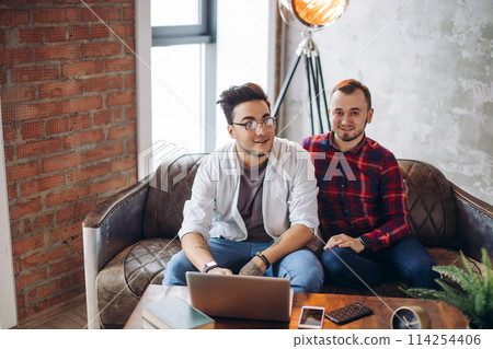Homosexual partners working at office desk, relationships and business concept Homosexual partners working at office desk, relationships and business concept 114254406