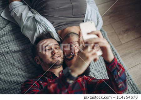 gay couple making selfie in bed gay couple making selfie in bed 114254670