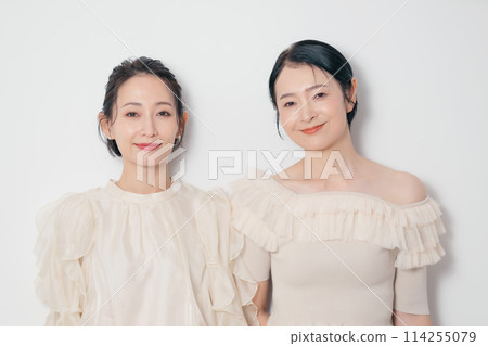 Fashion portrait of two stylish middle-aged women, skin care, cosmetics Fashion portrait of two stylish middle-aged women, skin care, cosmetics 114255079