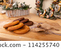 Home made giant cookies on wooden table with pieces of star anise and cinnamon 114255740