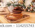 Home made giant cookies on wooden table with pieces of star anise and cinnamon 114255743