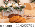 Home made giant cookies on wooden table with pieces of star anise and cinnamon 114255751