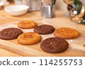 Home made giant cookies on wooden table with pieces of star anise and cinnamon 114255753