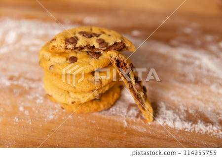 Home made giant cookies on wooden table with pieces of star anise and cinnamon Home made giant cookies on wooden table with pieces of star anise and cinnamon 114255755