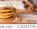 Home made giant cookies on wooden table with pieces of star anise and cinnamon 114255756