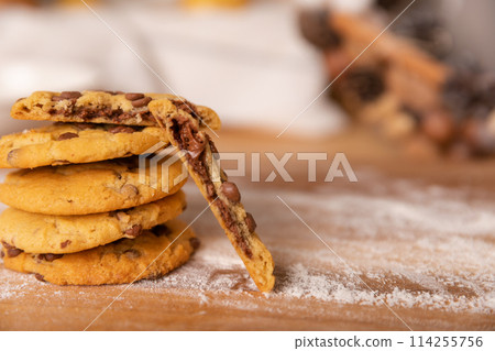 Home made giant cookies on wooden table with pieces of star anise and cinnamon 114255756