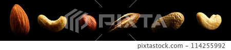 Group of nuts isolated on black background. Close-up Group of nuts isolated on black background. Close-up 114255992