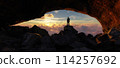 Adult adventurous man standing in a cave. 3d rendering mountain adventure artwork. 114257692