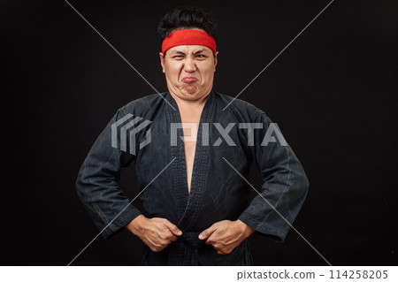 Fat tensed man shows his muscle Fat tensed man shows his muscle 114258205