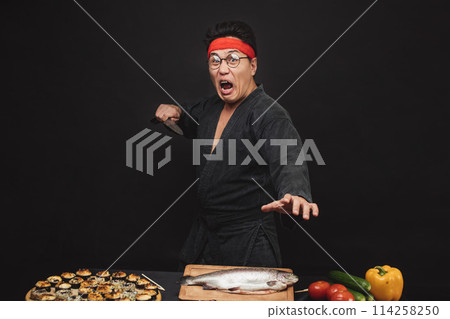 shouting crazy karate man preparing sushi 114258250