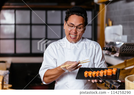 pleasant man presenting his dish pleasant man presenting his dish 114258290