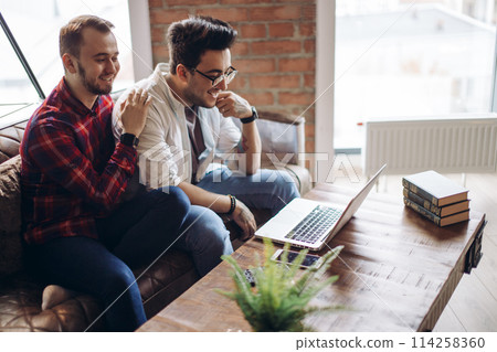 Homosexual partners working at office desk, relationships and business concept Homosexual partners working at office desk, relationships and business concept 114258360