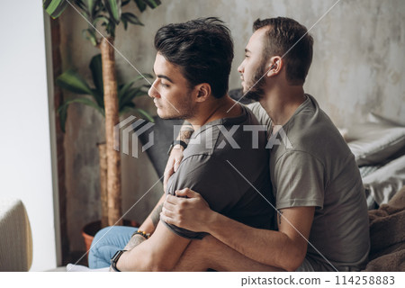 Two sexy caucasian gay guys hugging and having fun in bed indoors Two sexy caucasian gay guys hugging and having fun in bed indoors 114258883