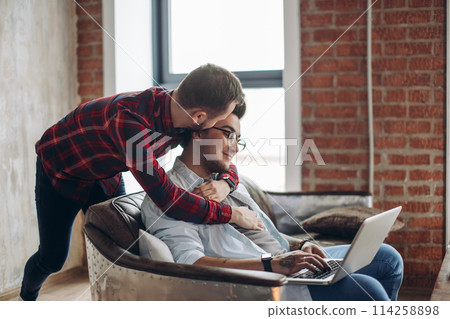 Homosexual partners working at office desk, relationships and business concept Homosexual partners working at office desk, relationships and business concept 114258898