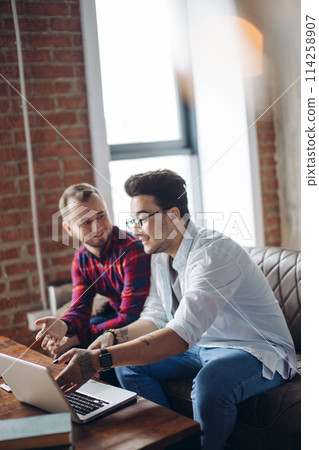 Homosexual partners working at office desk, relationships and business concept Homosexual partners working at office desk, relationships and business concept 114258907